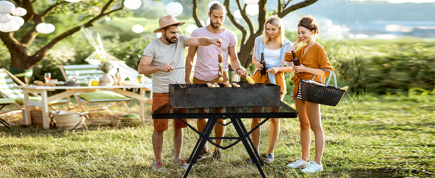 WildFinder 3 FT folding grill table used by friends grilling at a park