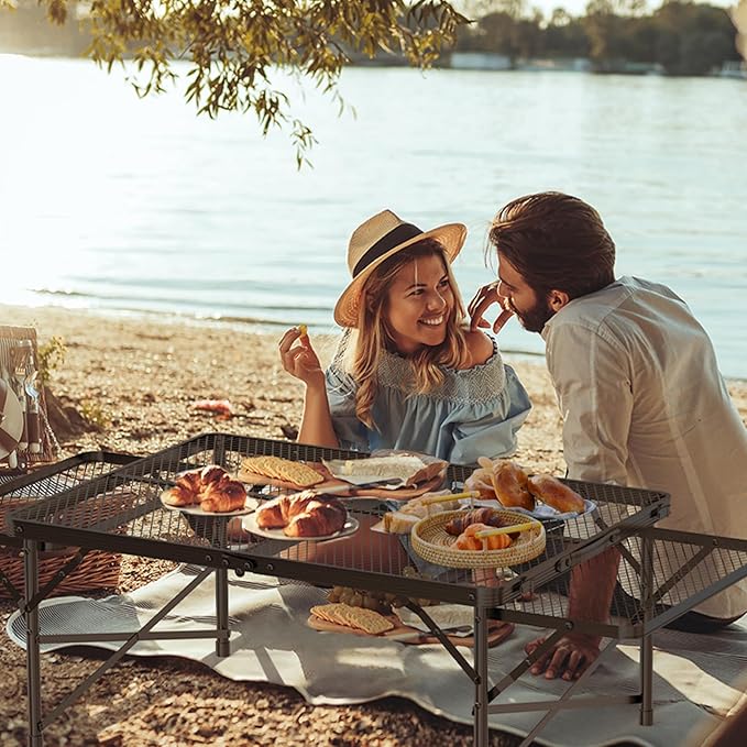 WildFinder 3x2 FT folding grill table with two wing panels at a lakeside picnic