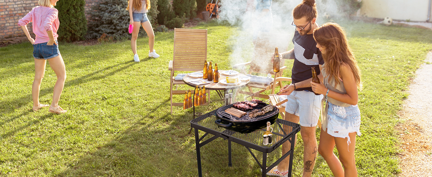 WildFinder compact folding table at a backyard barbecue with friends